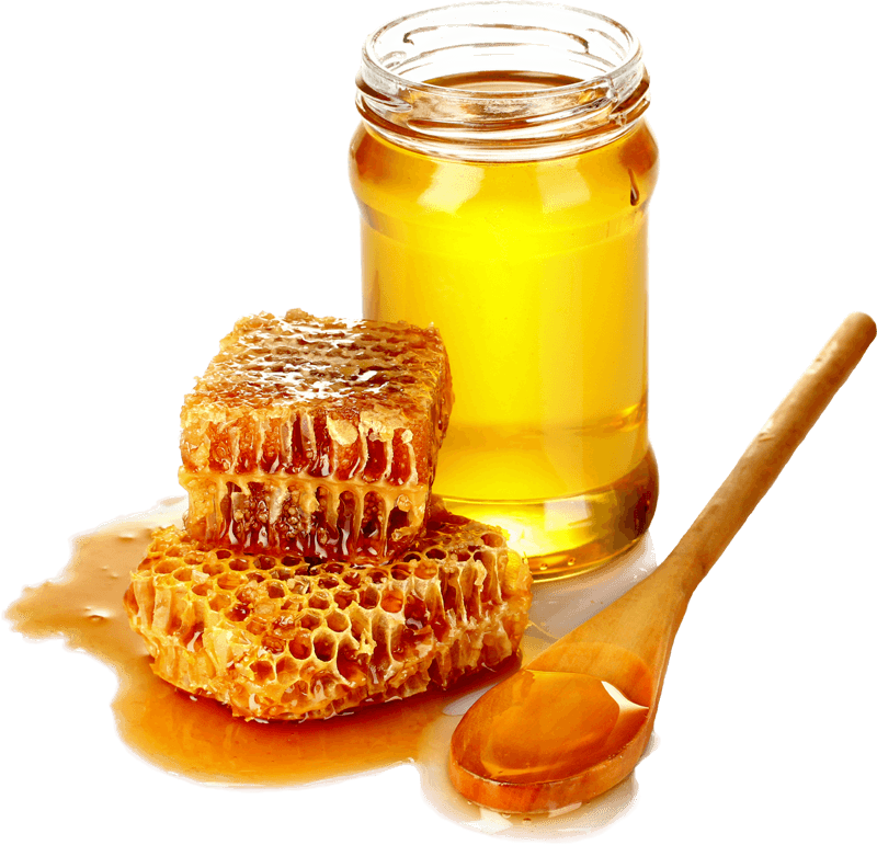 A jar of sweet local honey sits next to two pieces of honeycomb, with a wooden spoon drizzled in honey beside them.